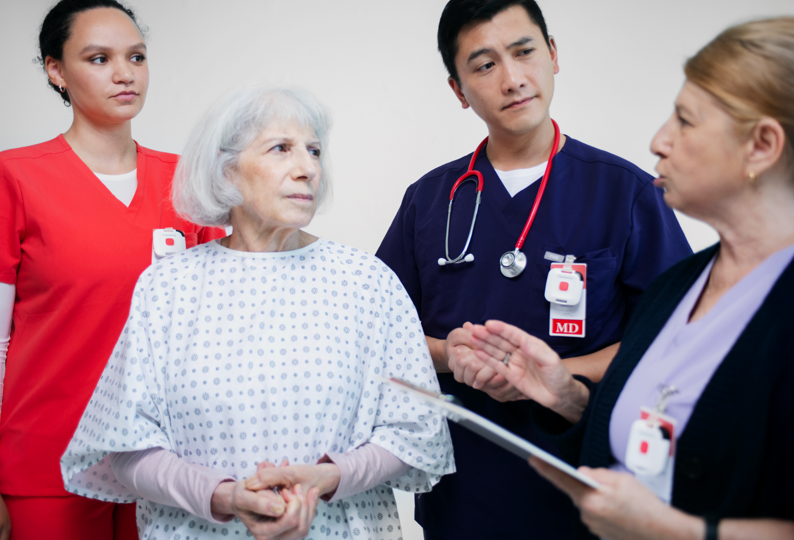 doctor and healthcare workers talking with patient