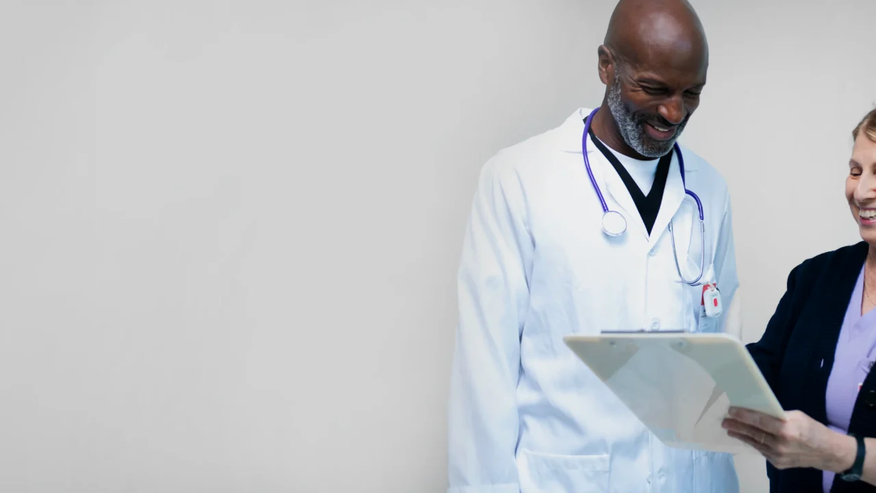 nurse and doctor checking documents