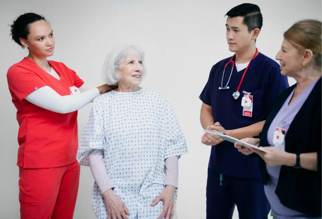 group of nurses and doctors taking care of the patient
