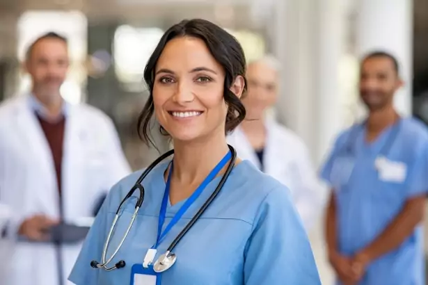 Portrait of friendly nurse smiling in hospital
